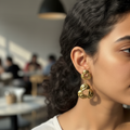 Twisted Knot Drop Earrings café ear close-up — waterproof gold earrings India — SIOBHÁN