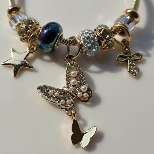Celeste Butterfly Charm Bracelet extreme close-up butterfly charm detail — anti-tarnish gold bracelet India — SIOBHÁN