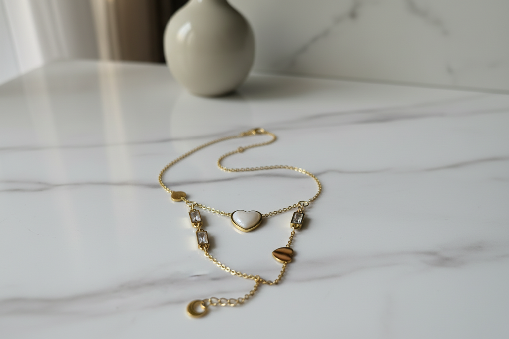 Golden Heart Dual Charm Bracelet on marble surface — anti-tarnish gold bracelet India — SIOBHÁN