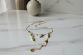 Golden Heart Dual Charm Bracelet on marble surface — anti-tarnish gold bracelet India — SIOBHÁN