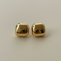 Gold Dome Studs on beige background — anti-tarnish gold stud earrings India — SIOBHÁN