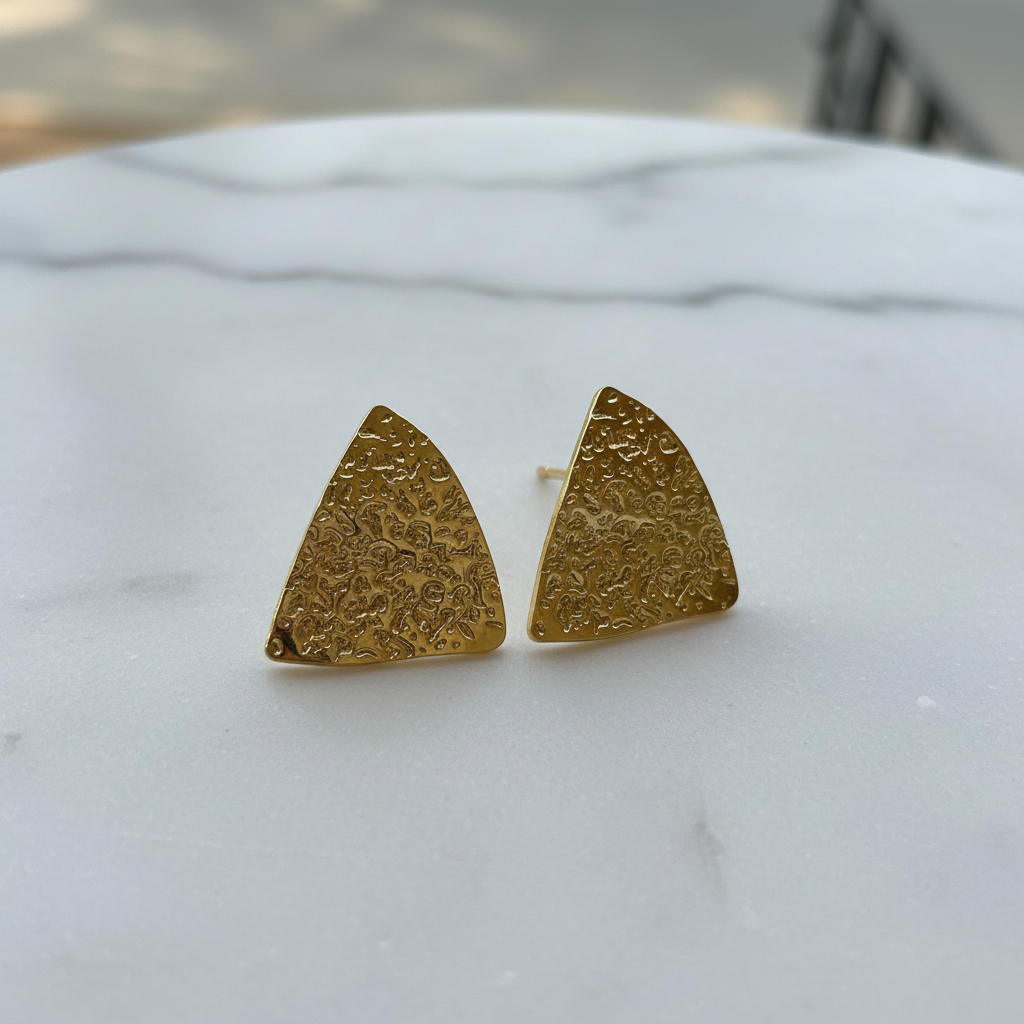 Textured Triangle Gold Studs on white marble — waterproof gold studs India — SIOBHÁN