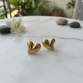 Amora Heart Stud Earrings on marble — anti-tarnish gold heart earrings India — SIOBHÁN