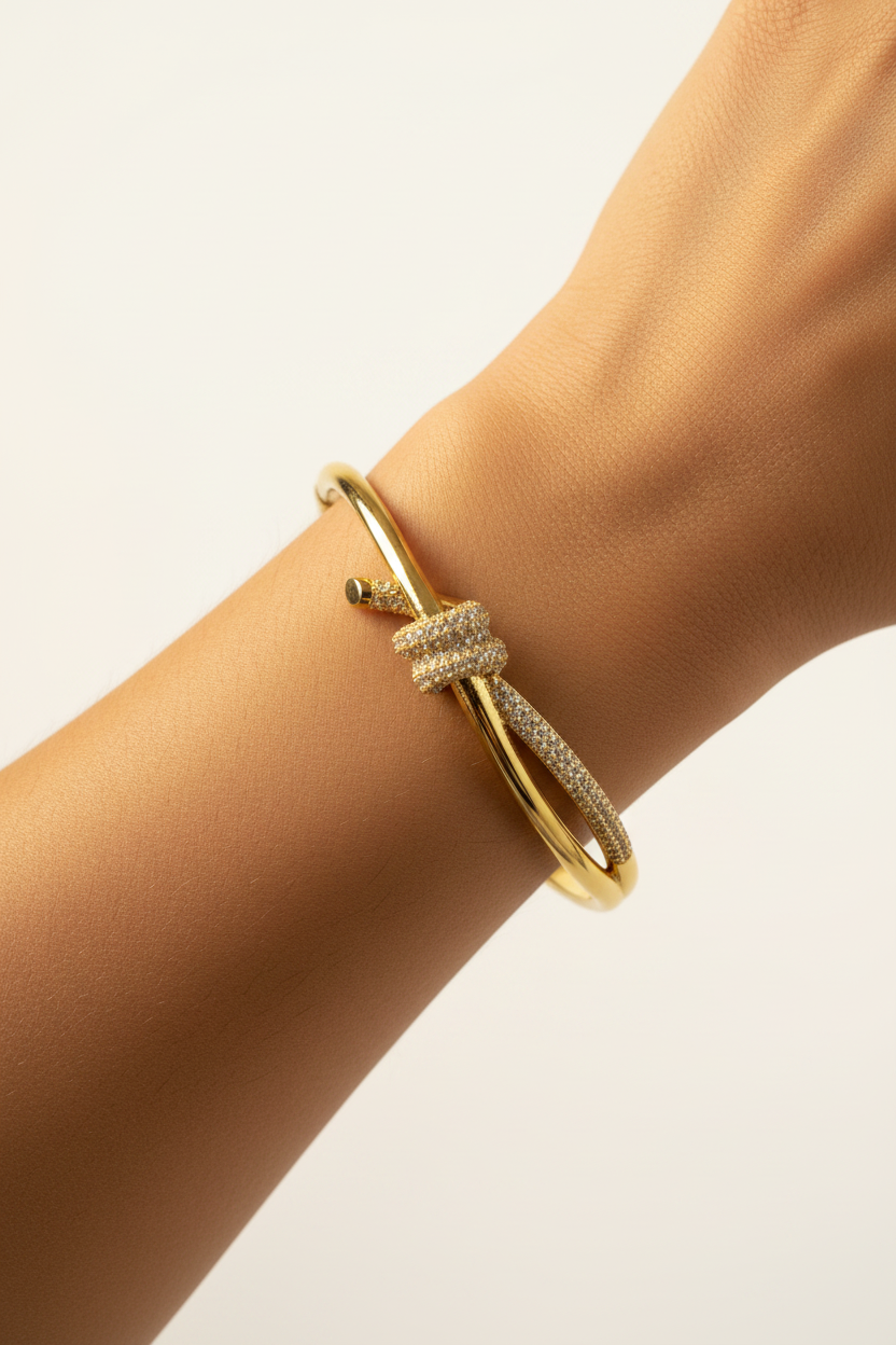 Pavé Knot Bangle — on wrist, studio