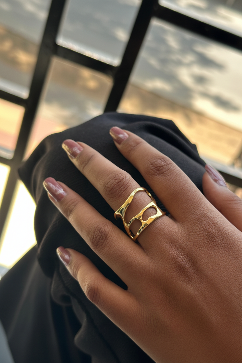 Open Lattice Sculptural Ring — on finger, golden hour