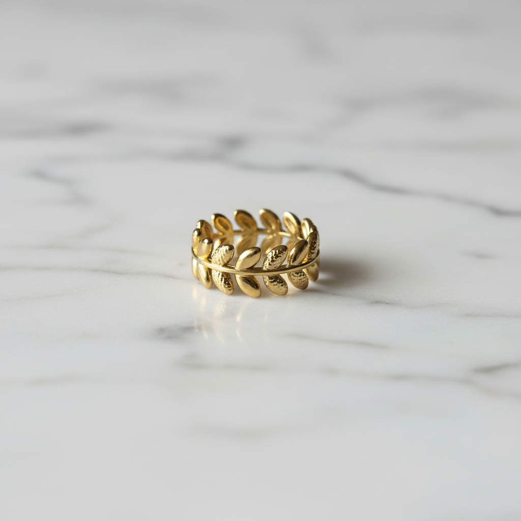 Gold Olive Leaf Wreath Band Ring — marble flat lay