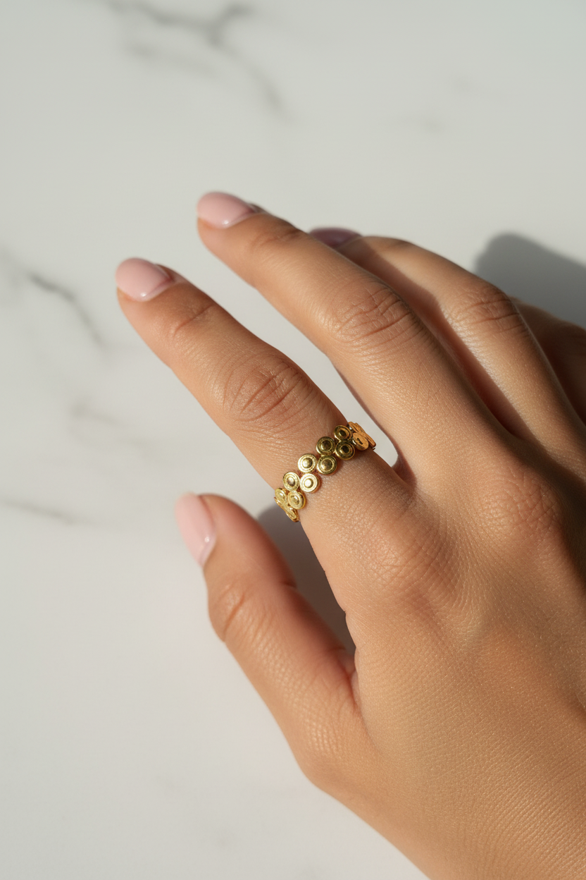 Double Bubble Coin Ring — on finger, marble daylight