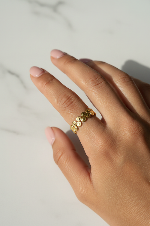 Double Bubble Coin Ring — on finger, marble daylight