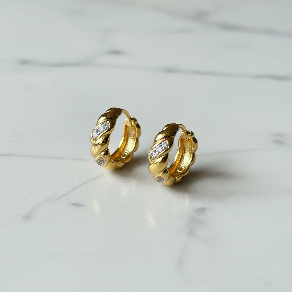Gold Twisted Rope CZ Huggie Hoops — marble flat lay