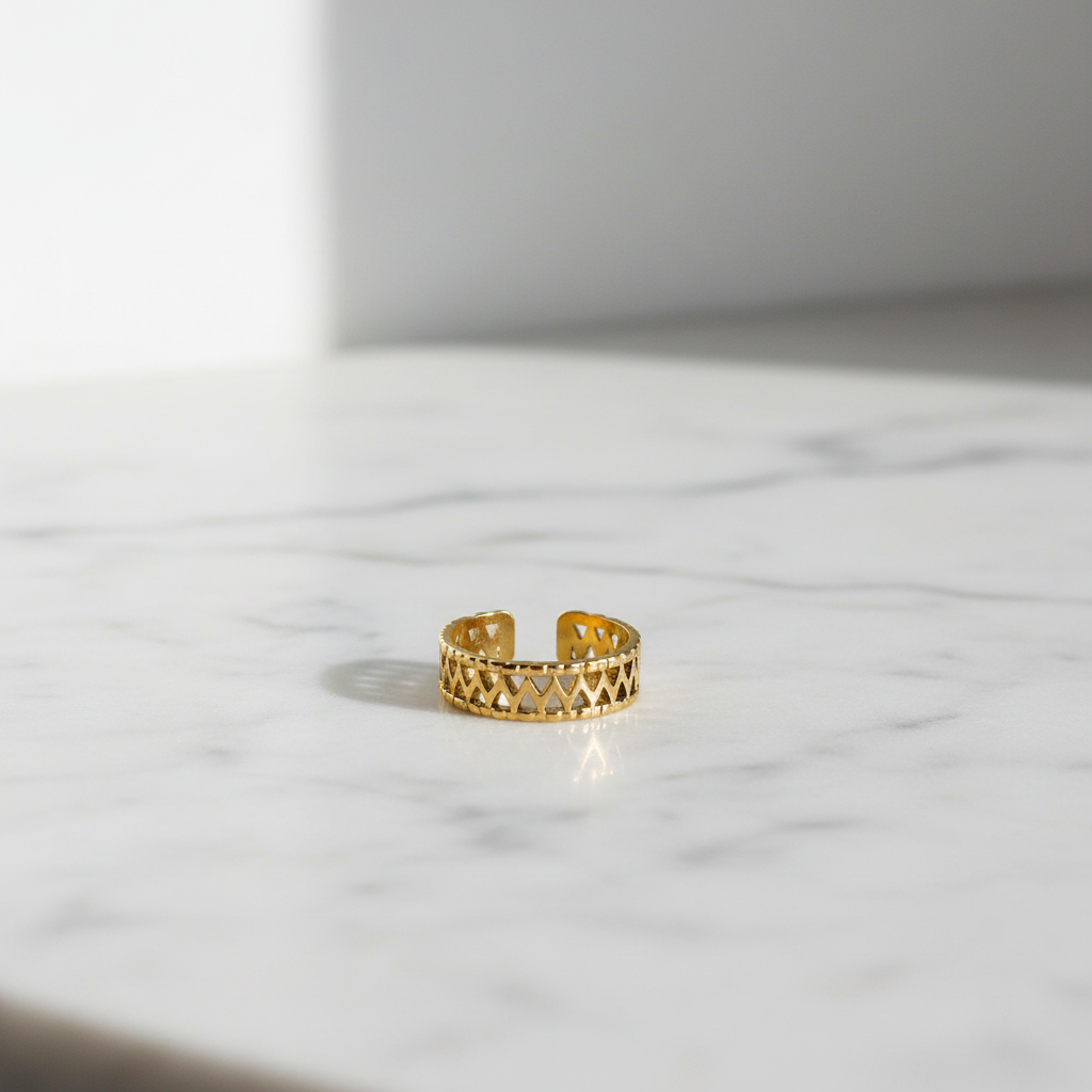 Gold Geometric Lattice Cuff Ring — marble flat lay