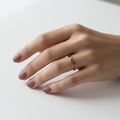 Gold Infinity Weave Band Ring — on finger editorial
