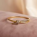 Pavé Knot Bangle — rose velvet background