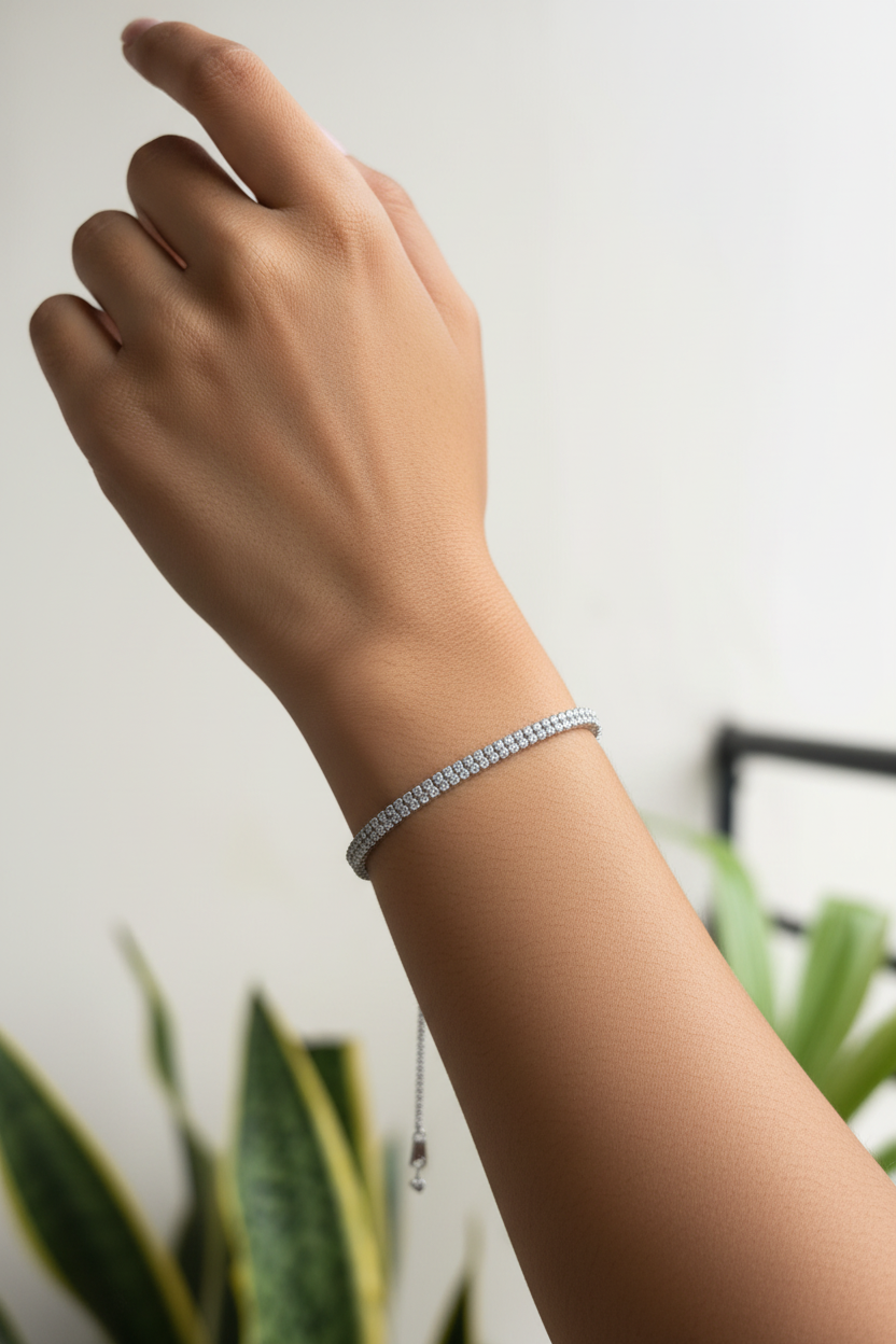 Silver crystal tennis bracelet worn on Indian woman's wrist