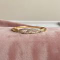 Pavé Twist Bangle — rose velvet background