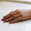 Gold Roman Numeral Cuff Ring — marble flat lay