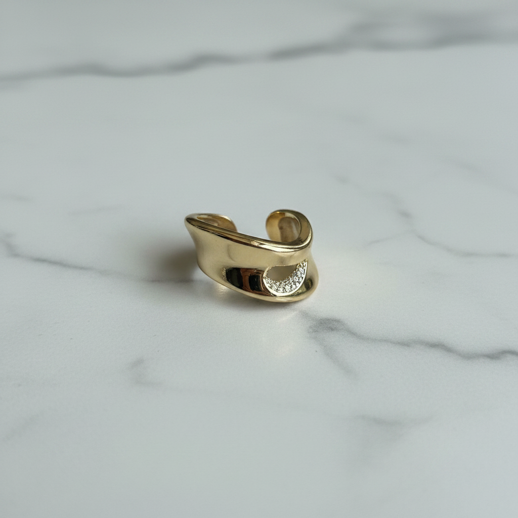 Gold Sculptural Crossover Wide Band Ring — marble flat lay