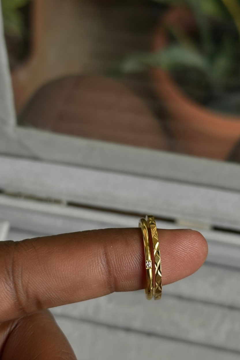 Diamond-Cut Solitaire Double Band Ring — on finger, marble