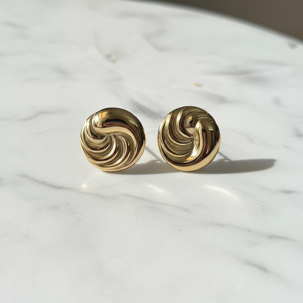 Gold Swirl Studs on marble — anti-tarnish gold stud earrings India — SIOBHÁN