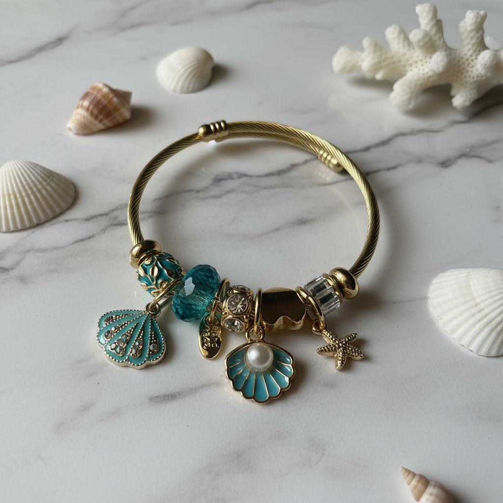 The Mermaid's Treasure Charm Bracelet marble surface styled shot — anti-tarnish gold bracelet India — SIOBHÁN
