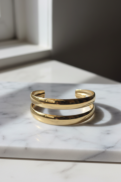 Double Band Gold Cuff Bracelet on minimalist marble surface — anti-tarnish gold bracelet India — SIOBHÁN
