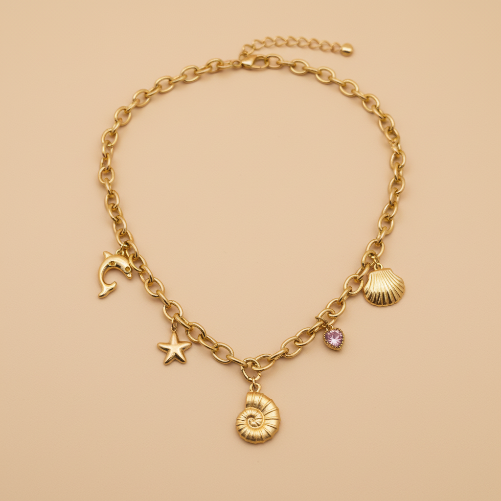 Ocean Charm Necklace on beige background — waterproof gold necklace India — SIOBHÁN