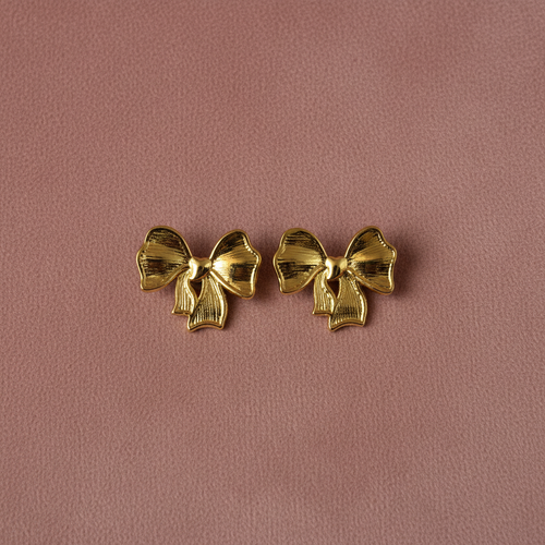 Bow Knot Earrings overhead flat lay — waterproof gold earrings India — SIOBHÁN